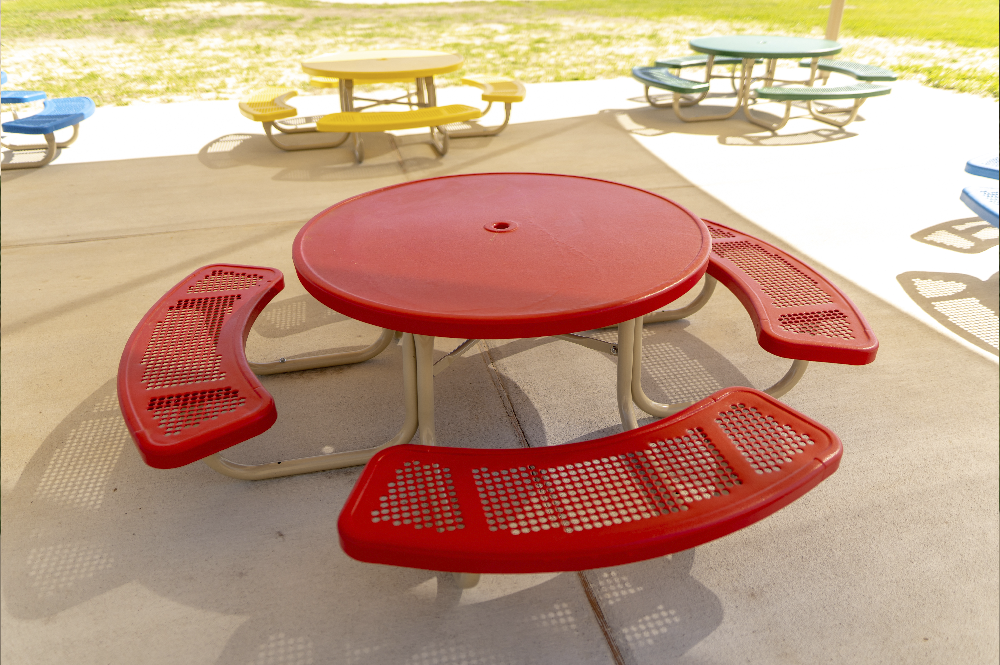 Red thermoplastic ADA picnic table with surface-mounted frame and wheelchair accessible seating for parks and schools